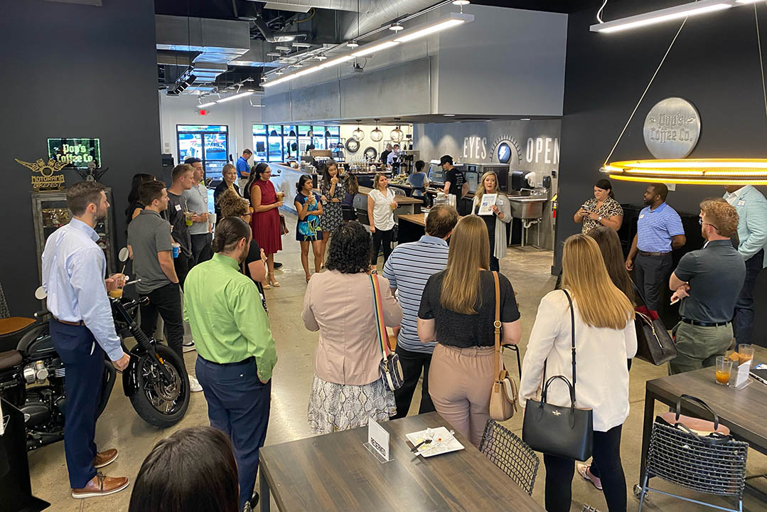 Next Gen Connects members standing around at an event